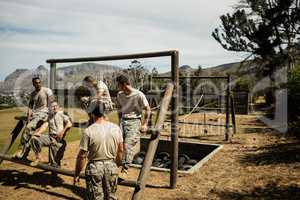 Soldiers sitting on the obstacle course