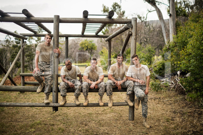 Soldiers sitting on the obstacle course in boot camp