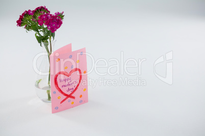 Close-up of happy mothers day card with flower vase