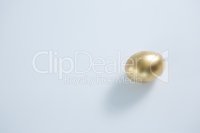 Golden Easter egg on white background