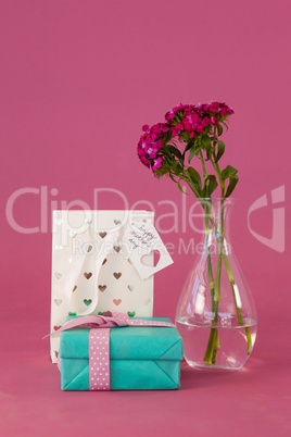 Gift box, paper bag and flowers vase