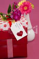 Happy mothers day card and flowers on gift boxes