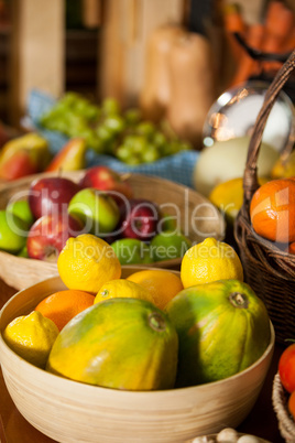 Close-up of fresh fruits in wicker basket at organic section