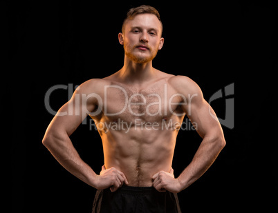 Young blond man with muscular torso
