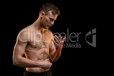 Bearded fighter man with boxing bandages