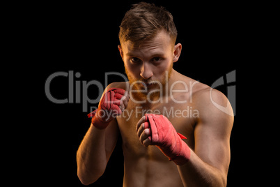 Fighter with red boxing bandages