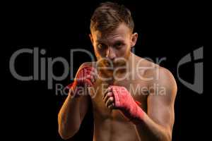 Fighter with red boxing bandages