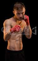 Young fighter with boxing bandages