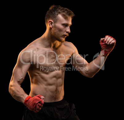 Young man during boxing training