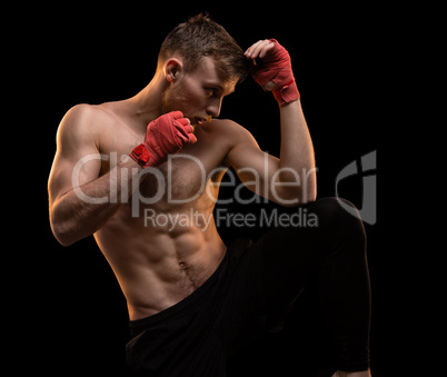 Muscular man during boxing training