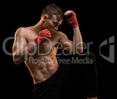 Muscular man during boxing training