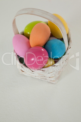 Various Easter eggs in wicker basket