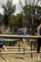 People jumping over the hurdles during obstacle course