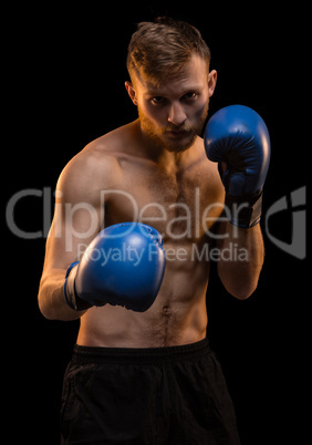 Bearded boxer man during workout