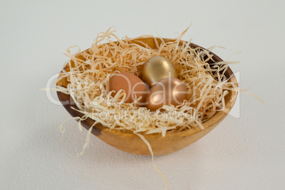 Golden easter eggs in bowl