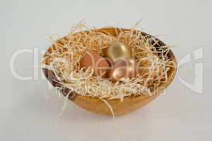 Golden easter eggs in bowl