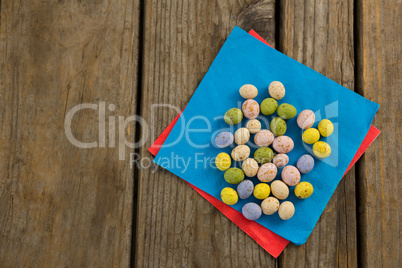 Colorful chocolate Easter eggs in napkin