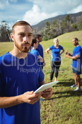 Man using digital tablet in boot camp