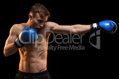 Muscular man with fist forward