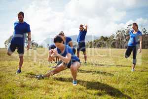 Fit people exercising in boot camp