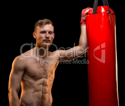 Boxer man with punching bag