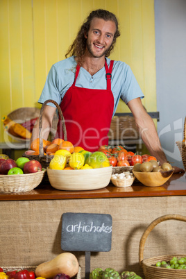 Portrait of smiling staff standing at counter