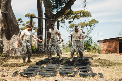 Trainer giving training to military soldiers