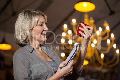 Female costumer checking bell pepper