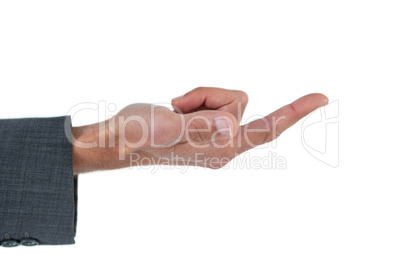 Businessman gesturing against background