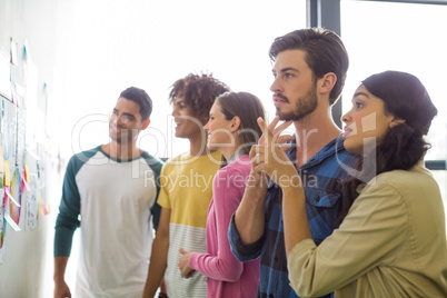 Graphic designers reading documents