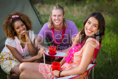 Friends smiling in park