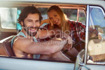 Couple sitting in a campervan