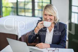 Businesswoman having coffee in a restaurant