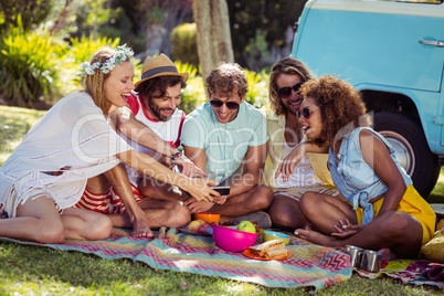 Group of happy friend taking a selfie in park