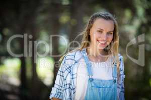 Smiling woman standing in park