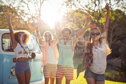 Portrait of group of friends dancing in the park