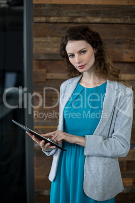 Female business executive using digital tablet