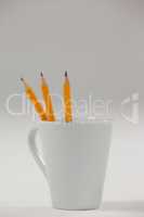 Three pencils kept in cup