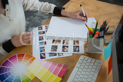 Female graphic designer working at desk