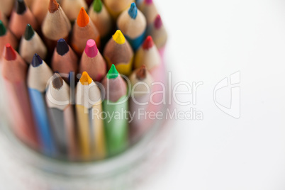 Close-up of colored pencils kept in a glass jar