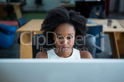 Female graphic designer using desktop pc