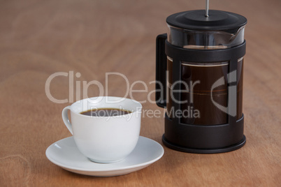 Cafetiere and a cup of black coffee