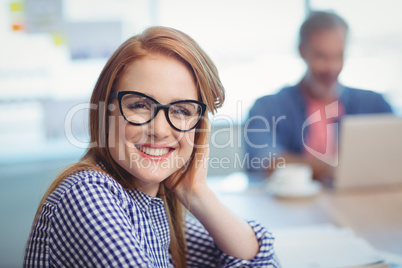 Portrait of female executive sitting in office