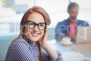 Portrait of female executive sitting in office