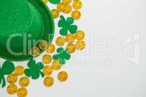 St. Patricks Day leprechaun hat, shamrocks and chocolate gold coins