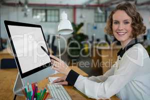 Happy woman working on desktop pc