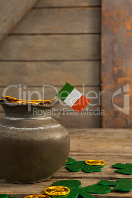 St. Patricks Day pot of chocolate gold coins with irish flag and shamrocks