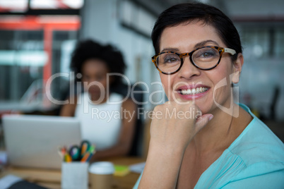 Female graphic designer in glasses smiling