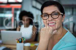 Female graphic designer in glasses smiling