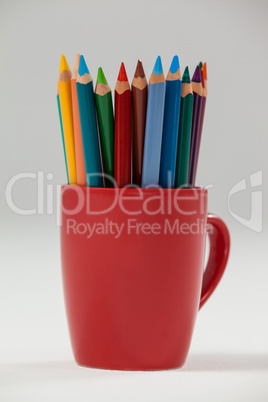 Colored pencils kept in cup